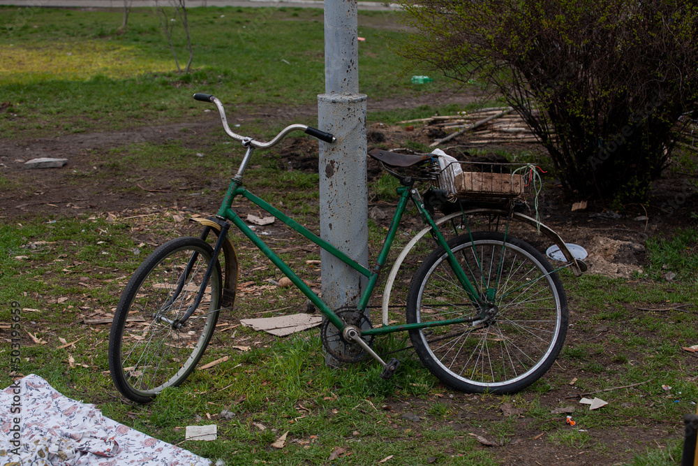 An old bicycle abandoned on the street