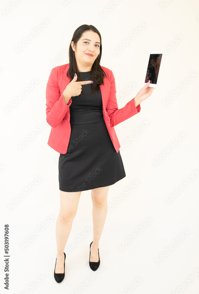 Naklejka premium Beautiful and successful asian businesswoman, in a black suit, pink jacket, satisfied managing her activities from her tablet, on a white backgroundd