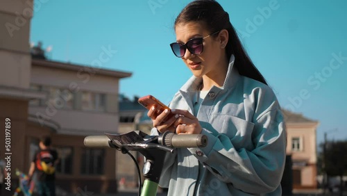 Woman ordering electric scooter with mobile app