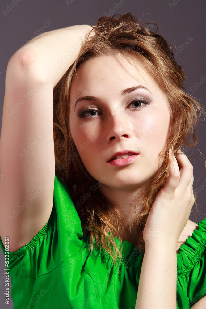 Φωτογραφία beautiful young girl in a short green dress and black stockings