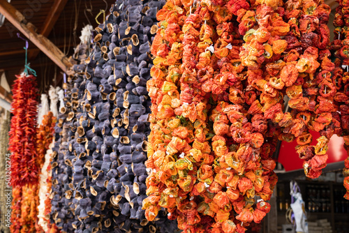 Hanging dried peppers and tomatoes -  sun dried marinated Turkish tomatoes, peppers and eggplants in the traditional bazaar at Gaziantep, the food capital of Turkey. 