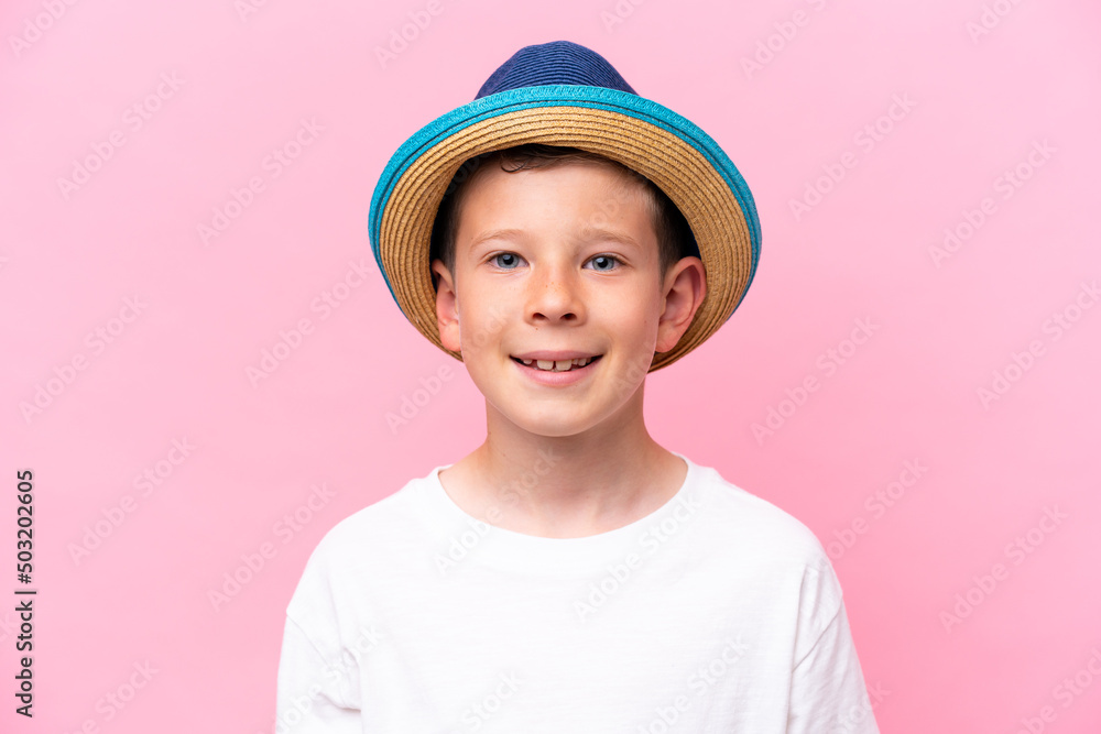 Little caucasian boy wearing a hat isolated on pink background Little caucasian boy wearing a hat isolated on pink background