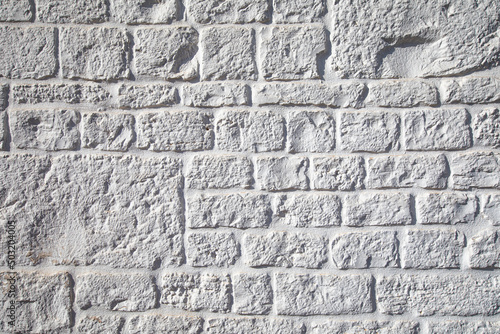 Wall out of white stones background, high resolution 