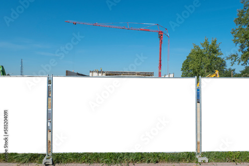 Advertising banner mock-up on the fence of construction site