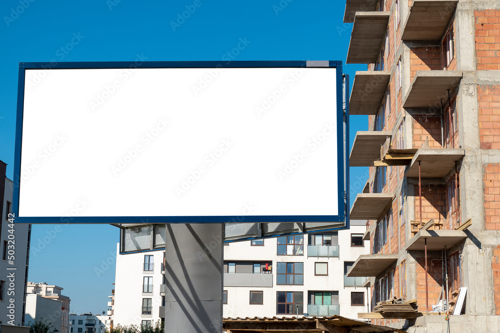 Blank white advertising billboard mock-up on the construction site area Blank white advertising billboard mock-up on the construction site area