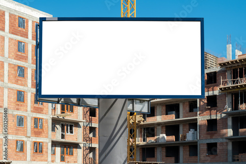 Blank white advertising billboard mock-up on the construction site area