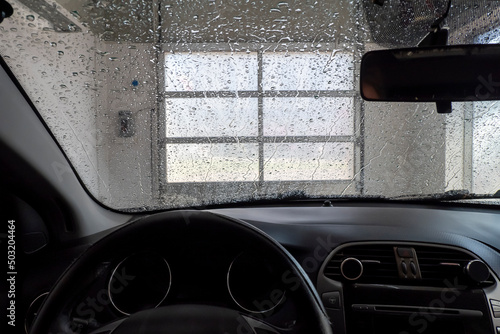 Drive-through carwash viewed from inside of the car.