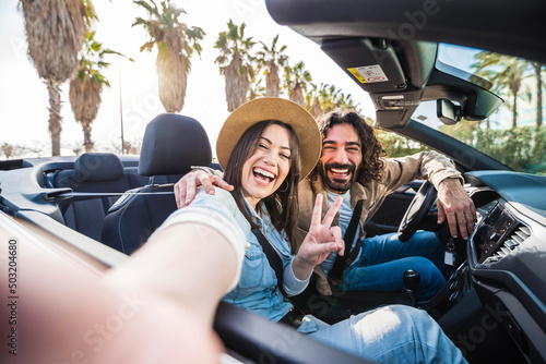 Photography Happy couple driving convertible car on summer vacation - Tourists rent automobi