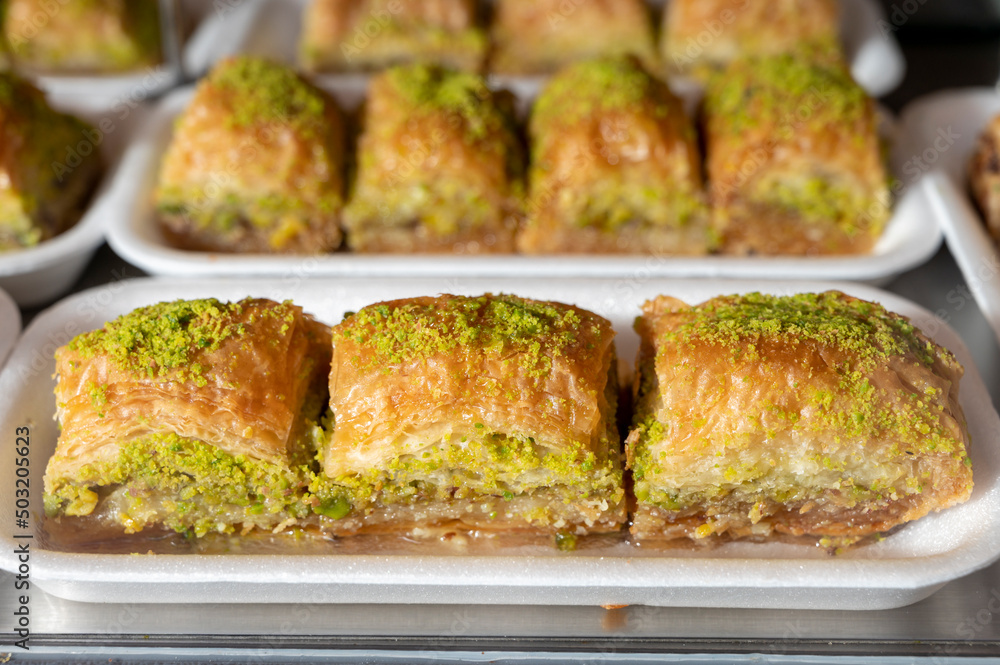 Turkish or arabic sweet dessert, baklava made from filo pastry, filled with chopped pistachio nuts and sweetened with syrup or honey.