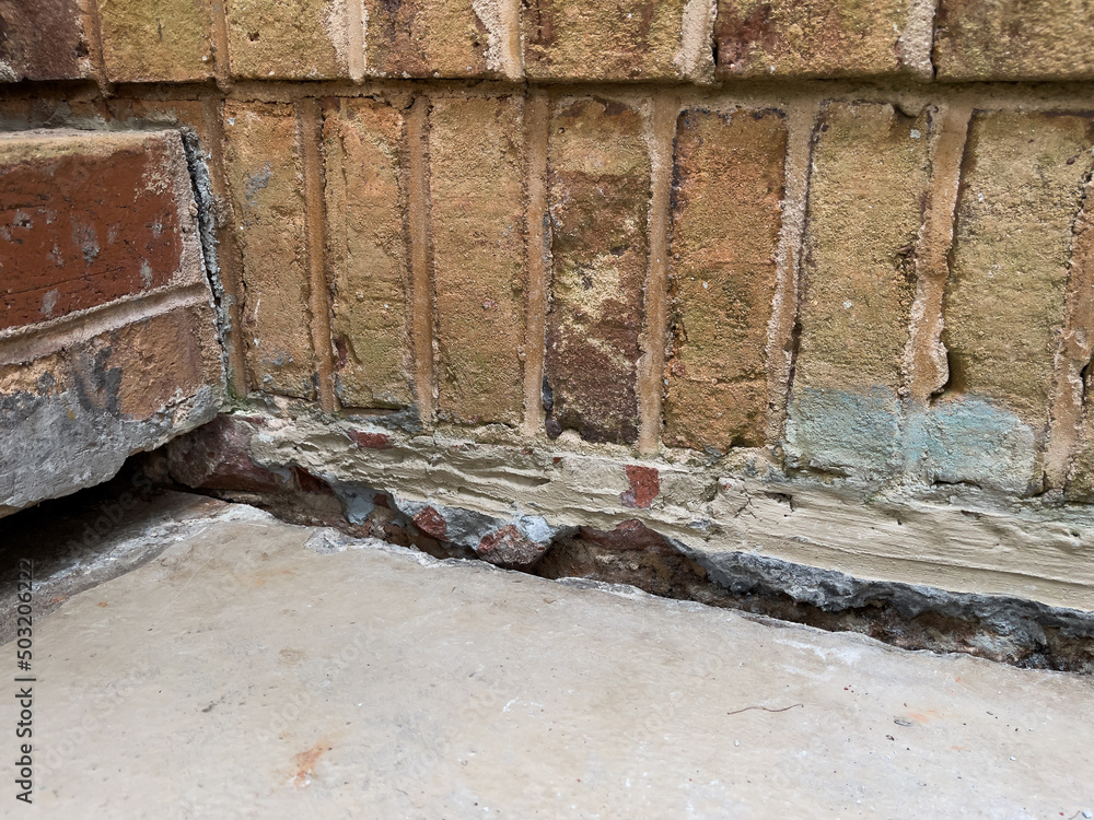 Sinking concrete foundation in need of mudjacking leveling repair
