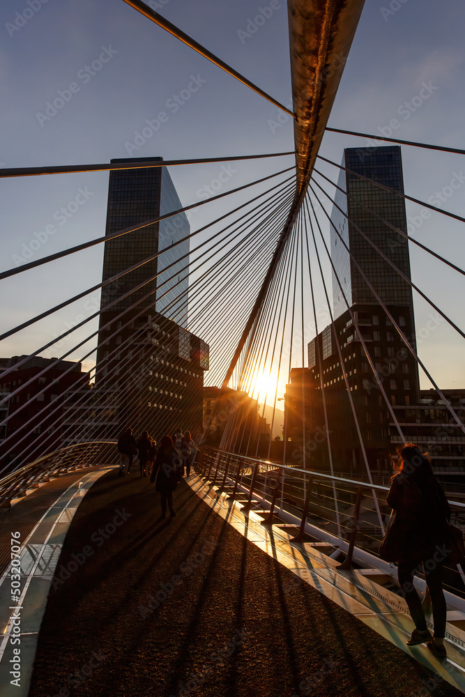 Fototapeta premium Sunset over Zubizuri bridge in Bilbao, Spain.