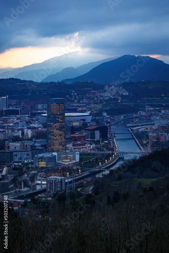 Dusk, twilight over Bilbao city in Basque Country, Spain. Town between mountains. © 9parusnikov