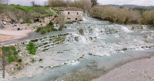 Aerial of thermal spa bath in Saturnia, Tuscany, Italy. Famous waterfall in italy. influencer hot sport 4K