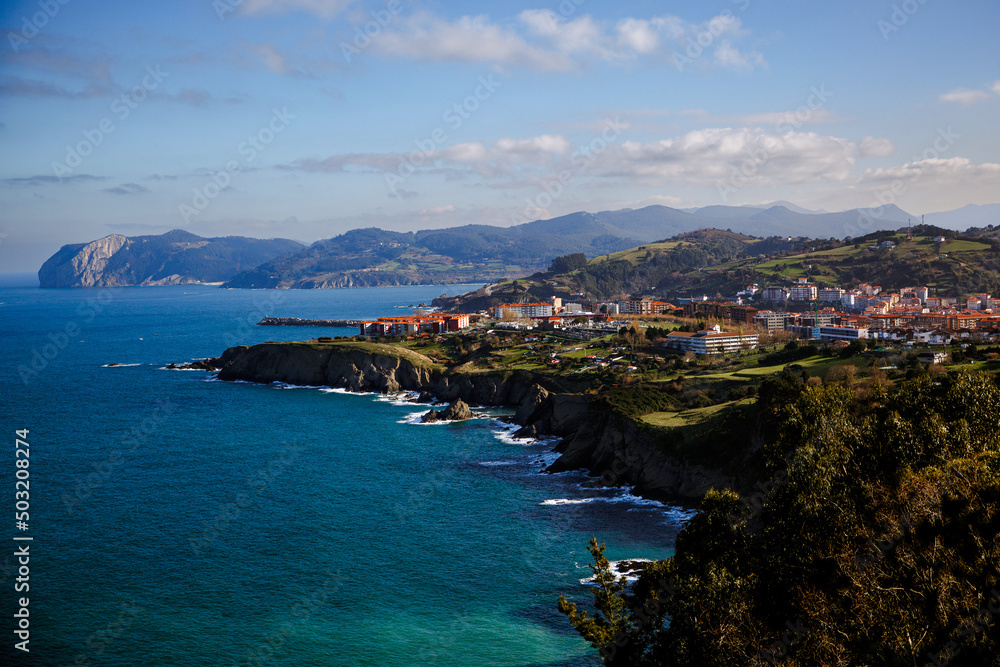Rocky shore with green meadow, aerial view. Bay of Biscay Coast, Northern Spain.
