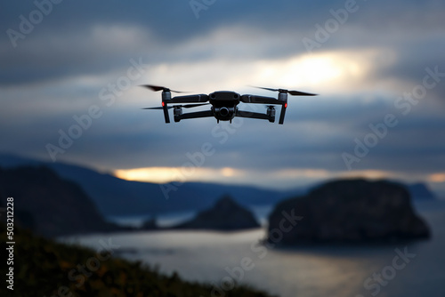 A drone flying over nature and making beautiful pictures and videos. photo