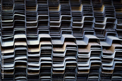 Face of full frame view on stacks of profile bent sheet metal parts