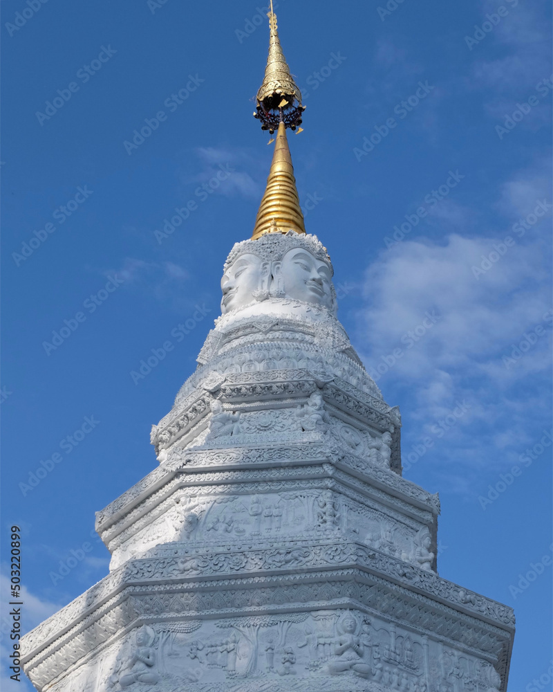 Buddhist old traditional  stupa on the blue sky background in temple in old city Chiang Mai Thailand 