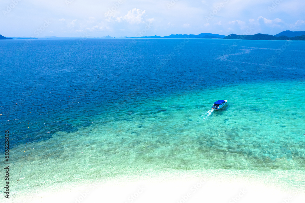 High angle view of the island, Andaman Sea, blue water, speed boat sailing from the Khai island beach of Thailand.