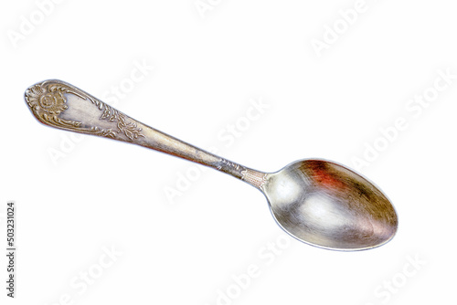 Antique silver spoon isolated on white background