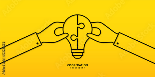 Hand holding  jigsaw puzzle on yellow background, Business solutions, cooperation and teamwork concept. Co-worker planning and strategy