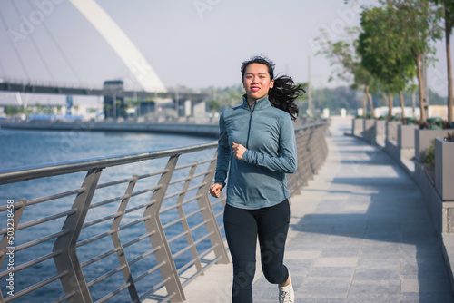 Photography Girl running in a modern city environment