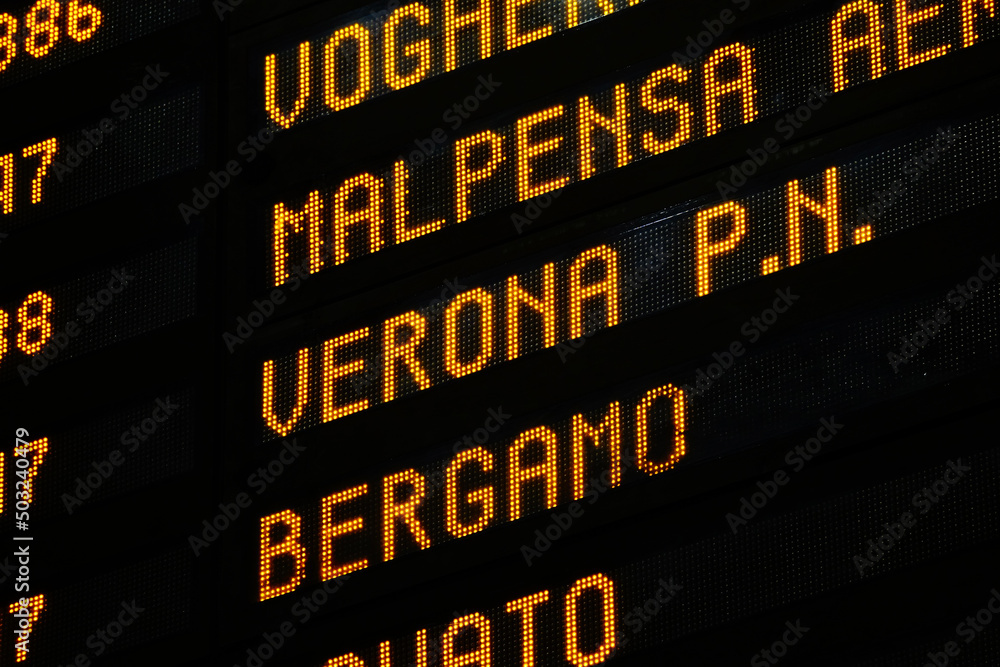Obraz premium Close-up of a departure board with different italian destinations in Central Station of Milano, Italy