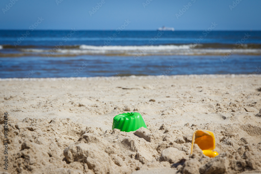 Children toys for relax or playing at beach. Summer, vacation time and child development Children toys for relax or playing at beach. Summer, vacation time and child development