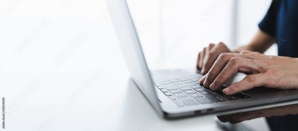 Businessperson working on laptop at workplace. Student studying or learning online via computer at home. Idea of business financial and education knowledge concept. Training course online via internet Businessperson working on laptop at workplace. Student studying or learning online via computer at home. Idea of business financial and education knowledge concept. Training course online via internet