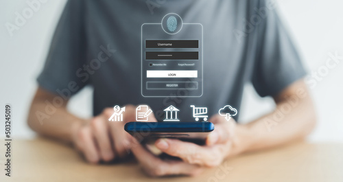 Man using smartphone for online banking or shopping and payment via credit card. Mobile phone fingerprint scan and login for security system. Business commercial and personal financial idea concept photo