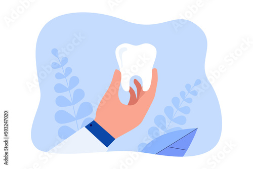Hand of cartoon dentist holding big tooth. Doctor with healthy tooth flat vector illustration. Dentistry, oral hygiene, health concept for banner, website design or landing web page
