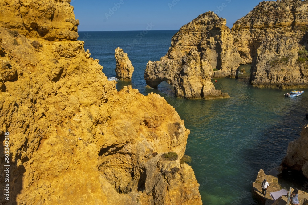 Obraz premium Panoramic view with Cliff, rocks and emerald sea at Ponta da Piedade near Lagos, Algarve, Portugal