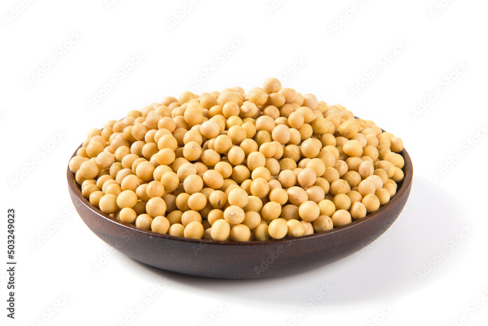 Soybean seeds in wooden plate isolated on white background Soybean seeds in wooden plate isolated on white background
