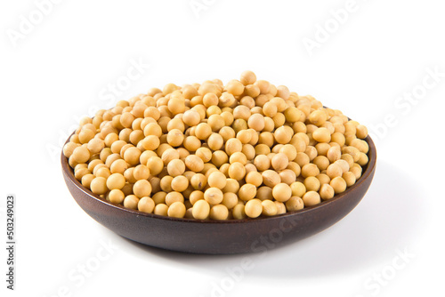 Soybean seeds in wooden plate isolated on white background