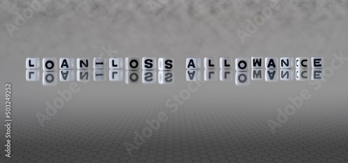 Photos loan loss allowance word or concept represented by black and white letter cubes