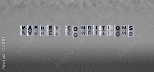 market conditions word or concept represented by black and white letter cubes on a grey horizon background stretching to infinity