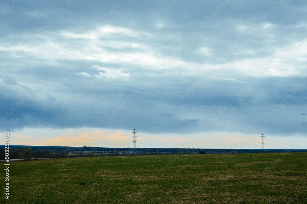 background landscape with big green field and blue sky and white clouds