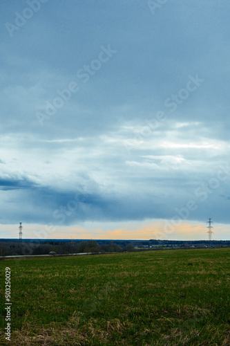 background landscape with big green field and blue sky and white clouds © Елизавета Фильченко