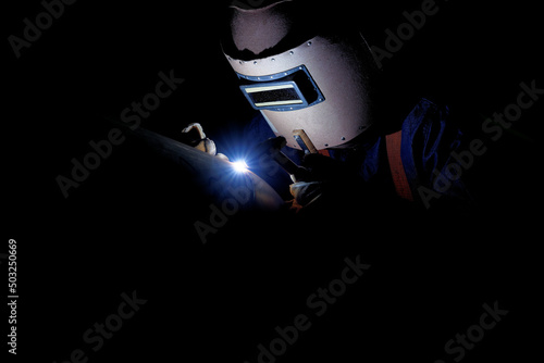 the close up of a welding worker working photo