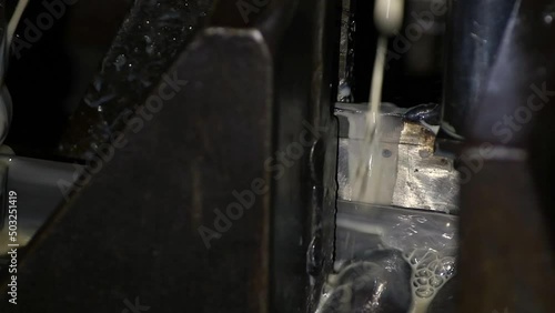 Industrial metalworking cutting automation process by milling CNC.Micro machining process , Coolant and lubrication.Close up of CNC machine at work.