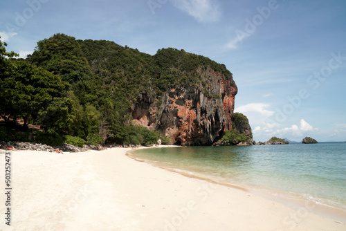 Landscape Traveller on Railay Phranang Beach white sand and blue sea with limestone in Railay Ao nang Krabi Thailand - sunny day summer 