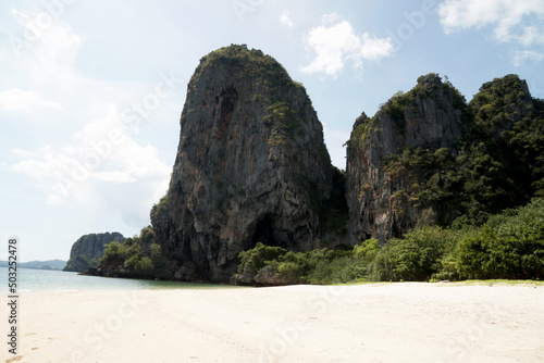 Landscape Traveller on Railay Phranang Beach white sand and blue sea with limestone in Railay Ao nang Krabi Thailand - sunny day summer 