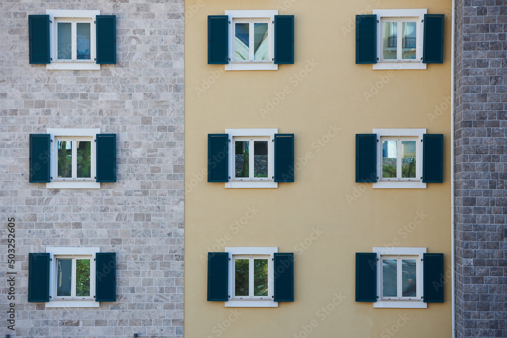 Windows with shutters on an apartment building