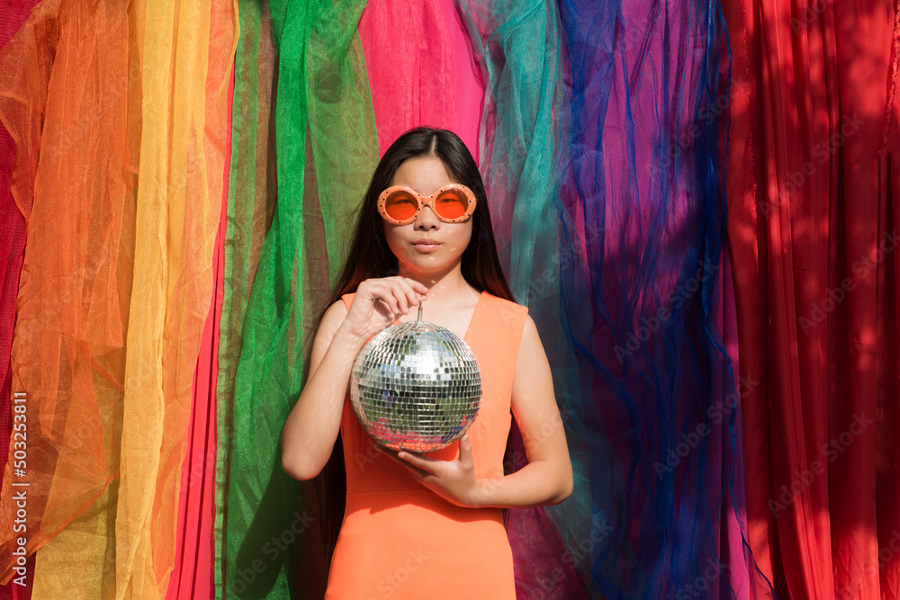© Milou Dirks - fine art portrait of a woman with disco ball in backdrop of rainbow lhbtq colors