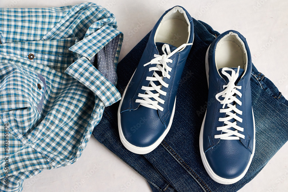 Fashionable suede sneakers. Sport shoes. Expensive footwear or