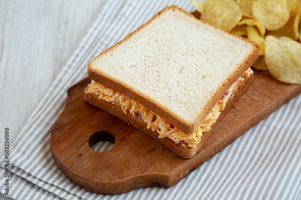 Homemade Pimento Cheese Sandwich with Chips, side view. Homemade Pimento Cheese Sandwich with Chips, side view.