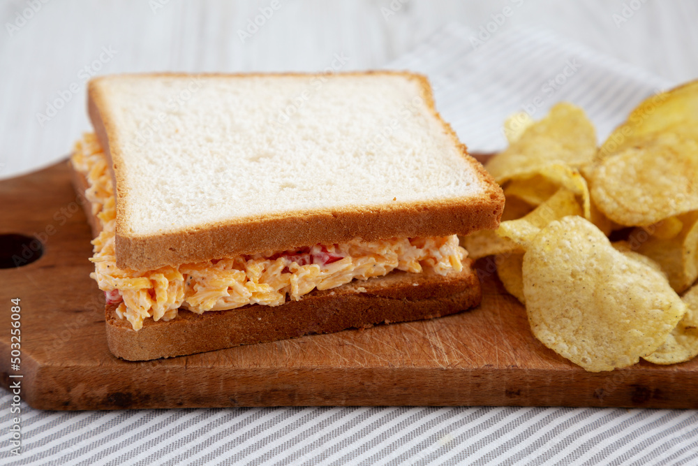 Homemade Pimento Cheese Sandwich with Chips, low angle view. Close-up. Homemade Pimento Cheese Sandwich with Chips, low angle view. Close-up.