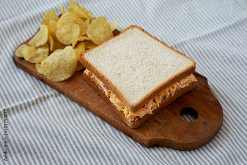 Homemade Pimento Cheese Sandwich with Chips, low angle view.