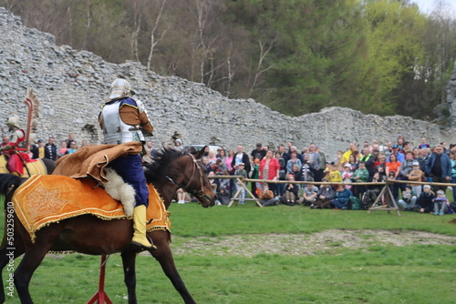a hussar on a rotten mare in a leopard cape and chain mail gallops with a sword on the preponderance Ogrodzeniec Malopolska Poland - May 1st 2022