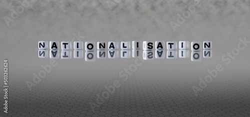 nationalisation word or concept represented by black and white letter cubes on a grey horizon background stretching to infinity