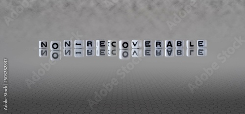 non recoverable word or concept represented by black and white letter cubes on a grey horizon background stretching to infinity